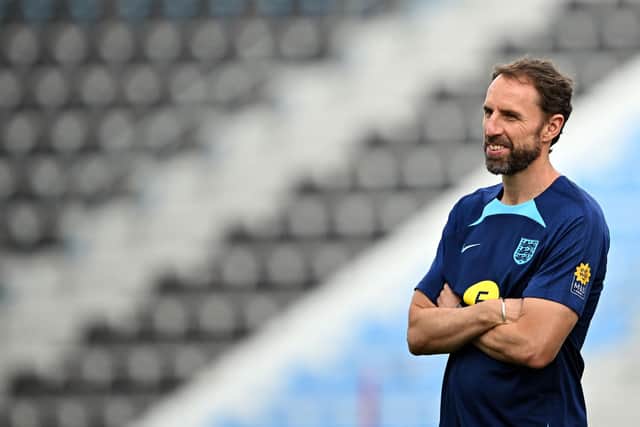 England's coach Gareth Southgate watches his players during a training session at the Al Wakrah SC Stadium in Al Wakrah, south of Doha, on December 7, 2022, during the Qatar 2022 World Cup football tournament. - England and France will meet in one of the Qatar 2022 World Cup quarter-finals on December 10.(Photo by PAUL ELLIS/AFP via Getty Images)