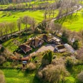 A shot from above of the substantial eight bedroom property that sits in a sublime location on the edge of Masham