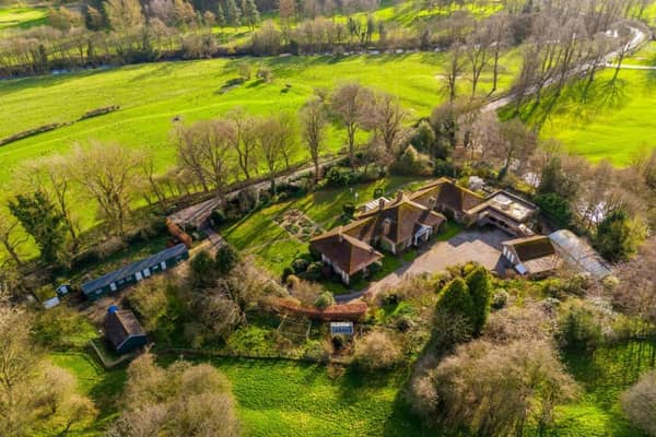A shot from above of the substantial eight bedroom property that sits in a sublime location on the edge of Masham