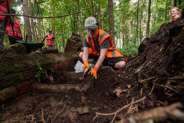 Lodge Moor POW Camp community archeological dig.
Toby Jones, 11, at work uncovering the reamins of the camps shower block.

26 August 2022.  Picture Bruce Rollinson