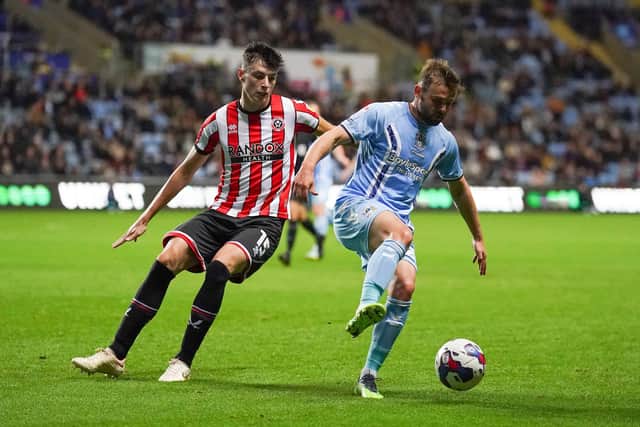 Coventry City's Matthew Godden (right) and Sheffield United's Anel Ahmedhodzic battle for the ball during the Sky Bet Championship match at the Coventry Building Society Arena, Coventry. Picture: PA.