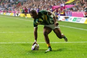 PITCH PROBLEMS: Shaun Williams scores for South Africa in the Commonwealth Games rugby sevens at Coventry City