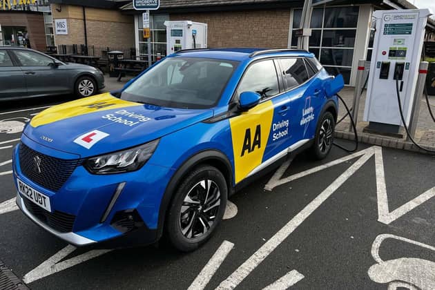 Library image of an electric car belonging to an AA driving instructor. US investor Stonepeak has taken a nearly half billion-pound stake in the AA. Photo by PA/AA)