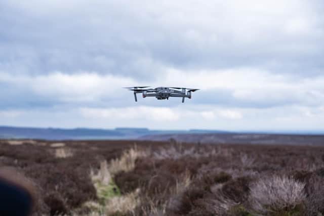 A drone monitors peatland.