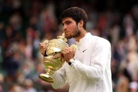 Long live the king: Carlos Alcaraz of Spain kisses the trophy after defeating Novak Djokovi in an epic Wimbledon men's singles final. (Picture: Julian Finney/Getty Images)