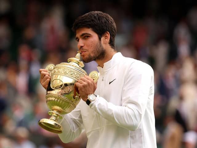 Long live the king: Carlos Alcaraz of Spain kisses the trophy after defeating Novak Djokovi in an epic Wimbledon men's singles final. (Picture: Julian Finney/Getty Images)