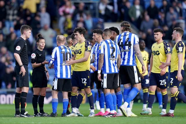 BUT, WHY?: Sheffield Wednesday’s Barry Bannan speaks with referee Rebecca Welch at full time at the Kassam Stadium Picture: Adam Davy/PA