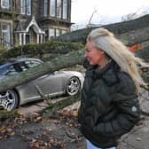 Zenya Dunne surveys the damage to her partner's Porsche 911
