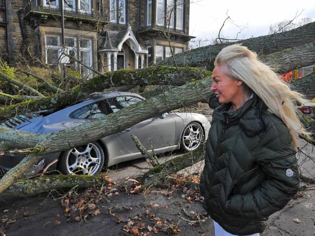 Zenya Dunne surveys the damage to her partner's Porsche 911