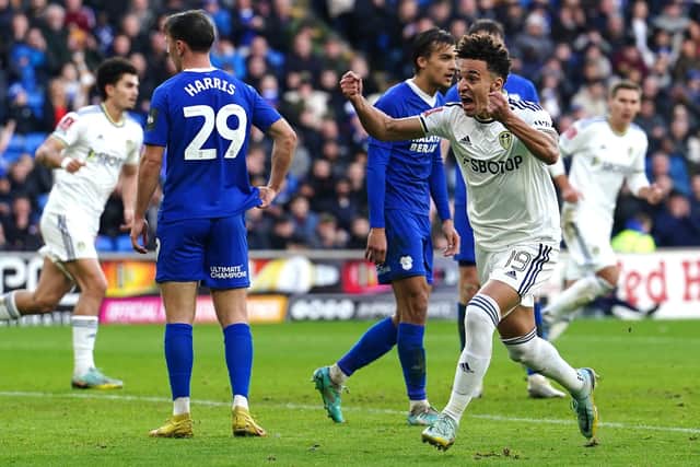 ON THE BOARD: Leeds United's Rodrigo Moreno celebrates scoring to halve the deficit against Cardiff City Picture: David Davies/PA