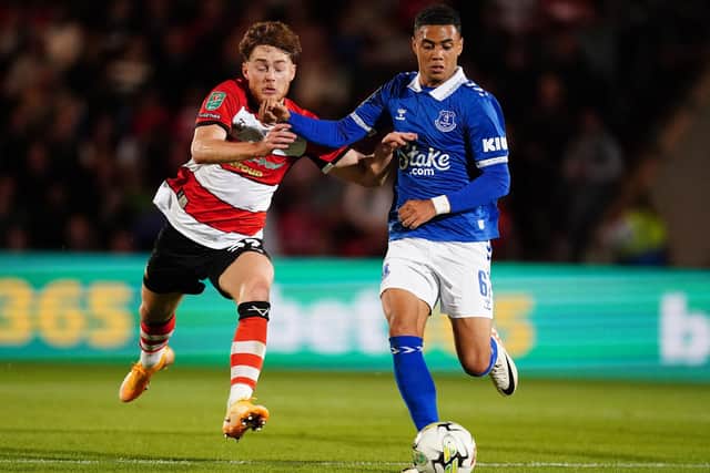 Everton’s Lewis Dobbin battles for the ball with Doncaster Rovers’ Jack Senior during the Carabao Cup second round match at the Eco-Power Stadium, Doncaster. Picture date: Wednesday August 30, 2023. PA Photo. See PA story SOCCER Doncaster. Photo credit should read: Mike Egerton/PA Wire.

RESTRICTIONS: EDITORIAL USE ONLY No use with unauthorised audio, video, data, fixture lists, club/league logos or "live" services. Online in-match use limited to 120 images, no video emulation. No use in betting, games or single club/league/player publications.