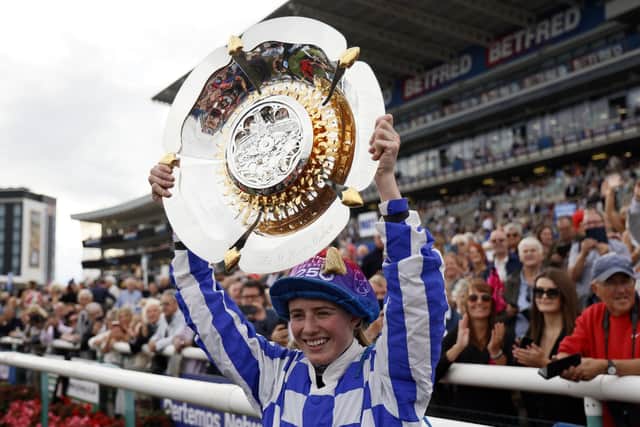 Saffie Osborne lifts the trophy after winning the Betfred St Leger Stakes on day three of the Betfred St Leger Festival at Doncaster Racecourse. PIC: Richard Sellers/PA Wire
