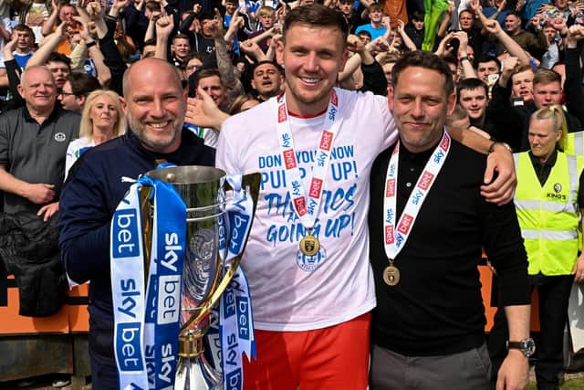 Charlie Wyke of Wigan Athletic with Dr Jonathan Tobin and Leam Richardson, then Wigan Athletic manager, who helped save his life. (Picture: Bernard Platt)