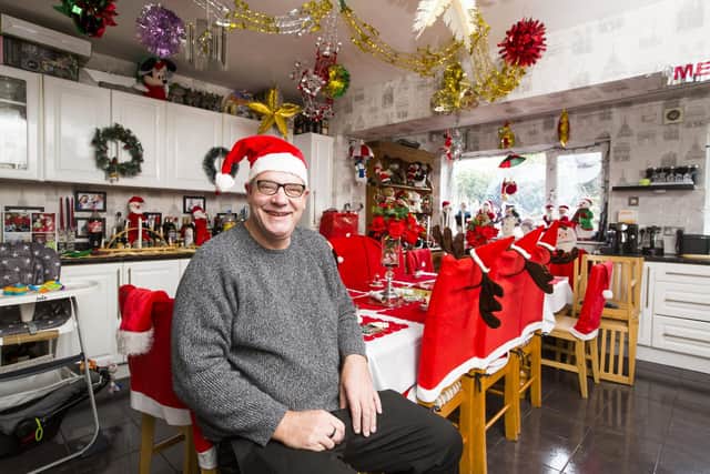 Allun Hudson at his home in Mytholmroyd with his Christmas decorations.