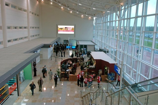 Travellers in the airport on its first day of operation on April 28, 2005.