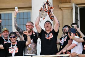 WINNER: Hull City coach Sergej Jakirovic (centre right) with the Championship play-off trophy as Hull City paraded it around the city (Image: Bruce Rollinson/PA Wire)