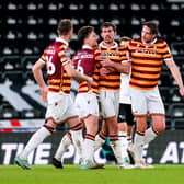 Bradford City's Sam Stubbs (centre right) celebrates with his team-mates after scoring their side's first goal of the game during the Bristol City Motors Trophy round of 16 match at Pride Park (Picture: PA)