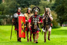 The 2nd Malton Museum Roman Festival 2023 held in Orchard Field, Malton. A celebration of Roman life in Malton and Norton with live action demonstrations from the Roman Cavalry by Equistry, marching and battle sequences from Magister Militum, Roma Antiqua and Legio VI Victrix. Pictured Roman legionaries (left to right) Steve Waghorn, (Sextus Calius Tuscus), Dave Grainger, (Marcus Minvcius Mudenus), Martin Williams, (Gavis Aerisus) and Phil Clegg, (Quintus Furentius Firmus) from Legio VI Victrix Eboracum march around the camp. Picture By Yorkshire Post Photographer,  James Hardisty. Date: 23rd September 2023.