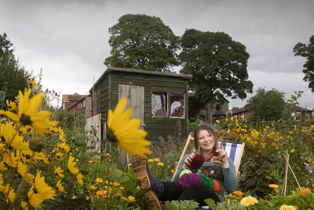 The Richmond Knitting group, Richmond. Natasha Cropper pictured knitting at Westfields allotment, Richmond. Picture taken by Yorkshire Post Photographer Simon Hulme 15th August 2023



