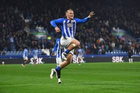 Huddersfield Town's Joe Taylor celebrates scoring his side's third goal against former club Peterborough United. Picture: Jonathan Gawthorpe