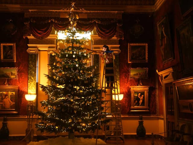 Long Live the Christmas Tree exhibition at Harewood House. Gemma Plumpton is pictured decorating one of the trees