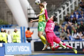 HEADSTART: Josh Sargent puts Norwich City ahead despite the efforts of Lee Nicholls