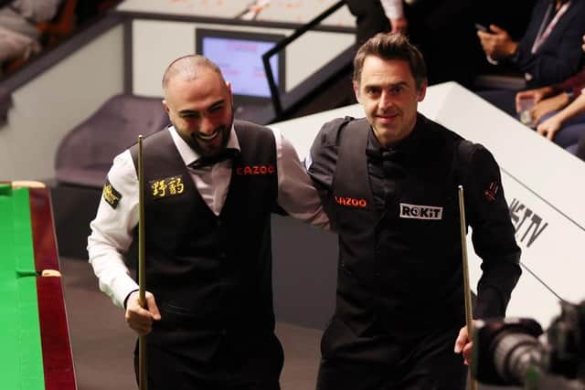 SHEFFIELD, ENGLAND - APRIL 22: Ronnie O'Sullivan (R) of England and Hossein Vafaei of Iran interact following the second session of their round two match on Day Eight of the Cazoo World Snooker Championship 2023 at Crucible Theatre on April 22, 2023 in Sheffield, England. (Photo by George Wood/Getty Images)