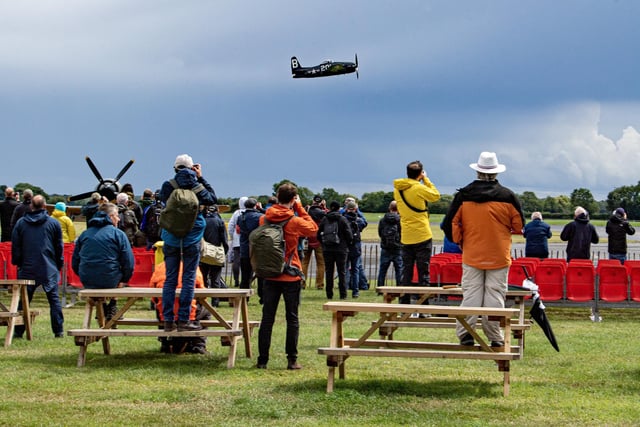 Crowds watch the Flying Legends warbirds