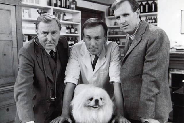 In the original BBC series of All Creatures Great and Small, James Herriot, played by Christopher Timothy, centre, lived and worked alongside the practice boss, Siegfried Farnon, played by Robert Hardy, left, and errant younger brother Tristan Farnon, played by Peter Davison. Picture: BBC