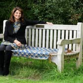 Solicitor Daxa Patel sat on her father's memorial bench in Golden Acre park in Leeds.