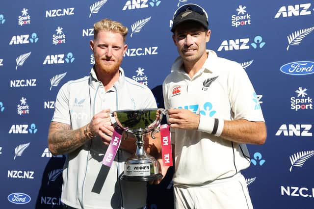 Ben Stokes, left, and Tim Southee share the series trophy after the 'Wonder of Wellington'. Photo by Phil Walter/Getty Images.
