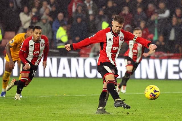 SPOT ON: Oliver Norwood converts Sheffield United's 99th-minute penalty