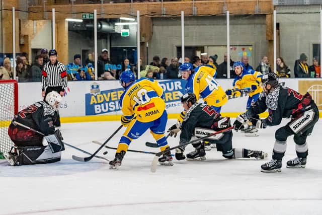 PRESSURE MOMENT: Leeds Knights' Carter Hamill (left) and Oli Endicott pile pressure on the Hull Seahawks net during Sunday night's NIHL National clash at Elland Road Ice Arena. Picture courtesy of Oliver Portamento
