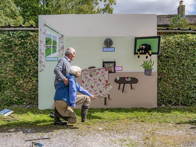 Clifford Lambert moves David Attenborough into place for this weekends Kettlewell Scarecrow Festival.