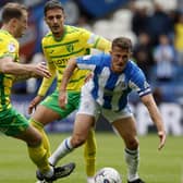 READY FOR ACTION: Huddersfield Town's Jonathan Hogg battles for the ball with Norwich City's Dimitris Giannoulis during the recent Championship clash at the John Smith's Stadium. Picture: Richard Sellers/PA