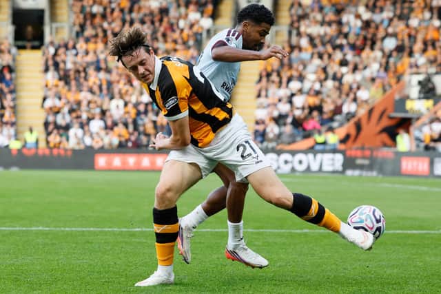 ON TEH STRETCH: Hull City's Elliot Stroud (left) and Aston Villa's Ian Maatsen compete (Image: Press Association)