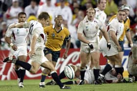 The winning moment: England fly-half Jonny Wilkinson kicks a drop goal as Australia captain and scrum-half George Gregan, centre, looks on helplessly during the Rugby World Cup final between Australia and England on November 22, 2003, in Sydney. (Picture: DAMIEN MEYER/AFP via Getty Images)