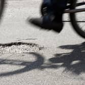 Pot holes: people's lived experience of the nation's roads tells a different story to the rhetoric being uttered (photo: PA)