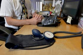 A file photo of a GP at their desk. PIC: Anthony Devlin/PA Wire