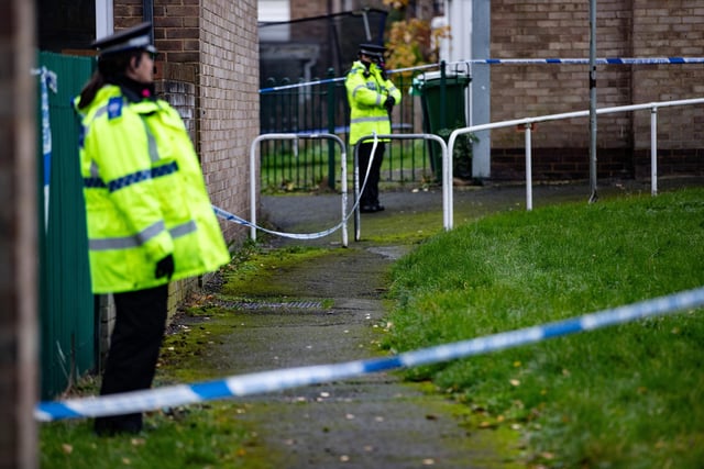 Police on the scene in Ravensthorpe, Dewsbury where a woman was murdered