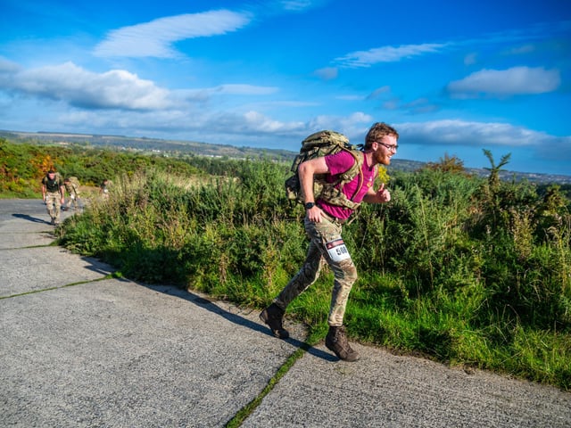 A soldier ran along the trail.
