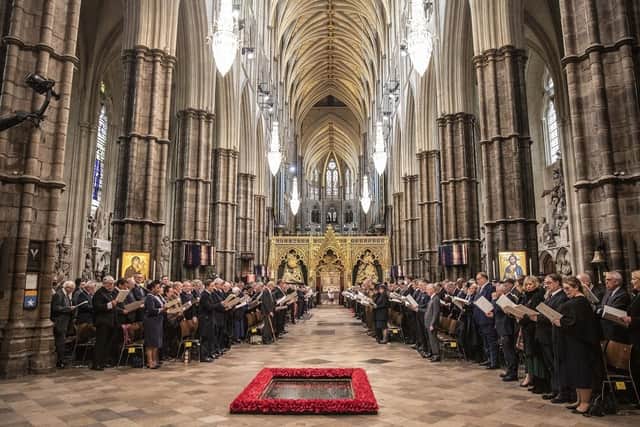 Members of the congregation sing hymns at Westminster Abbey. (Pic credit: Richard Pohle / Getty Images)