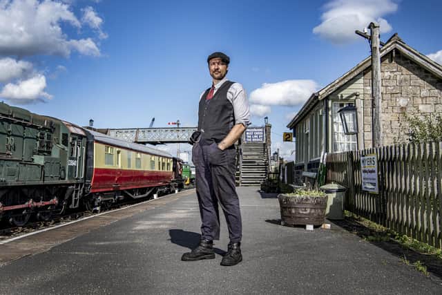 Carriage and wagon manager Aaron Marsden by the historic buffet car, the British Railways  express which  ran non-stop from London to Edinburgh from 1953 (marking the Queen's Coronation) to 1963 now rehomed at the Embsay and Bolton Abbey Steam Railway in the Yorkshire Dales