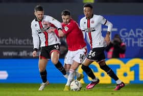 MIXED FORTUNES: Sheffield United's Oliver Norwood (left) and Daniel Jebbison (right)