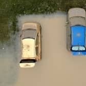 Water damaged cars are seen as flood waters begin to recede in the village of Catcliffe after Storm Babet flooded homes, business and roads. PIC: Christopher Furlong/Getty Images