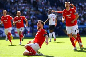 BOLTON, ENGLAND - MAY 13: Nicky Cadden of Barnsley celebrates after scoring the team's first goal during the Sky Bet League One Play-Off Semi-Final First Leg match between Bolton Wanderers and Barnsley at University of Bolton Stadium on May 13, 2023 in Bolton, England. (Photo by Michael Steele/Getty Images)