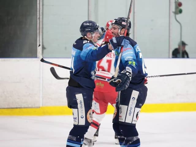 PARTY TIME: Alex Graham (left) and Matt Bissonnette celebrate a Sheffield Steeldogs' goal against Swindon Wildcats. Picture courtesy of Peter Best/Steeldogs Media
