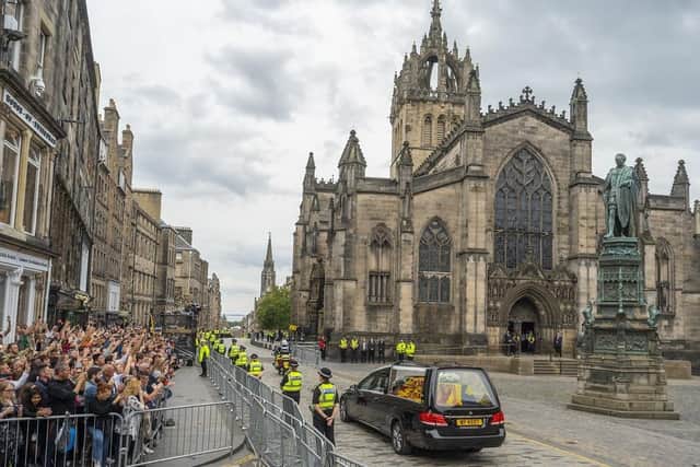 The hearse carrying the coffin of Queen Elizabeth II passes St Giles Cathedral. (Pic credit: Phil Wilkinson / PA)