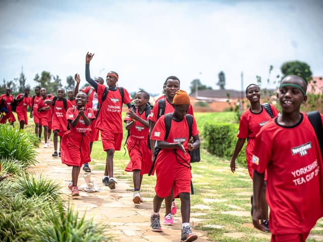 Cricketers linked to Rwanda's Sorwathe tea factory at Gahanga Stadium. Picture: Don Mugisha.