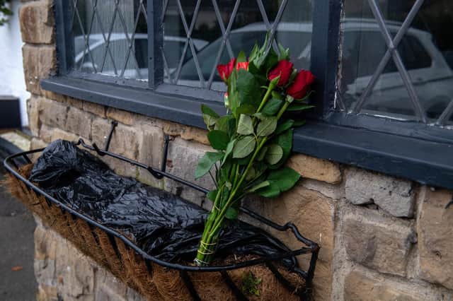 Bunch of roses left at The Three Horse Shoes at Oulton where the body of a new born bay girl was found in the toilets on Sunday.
